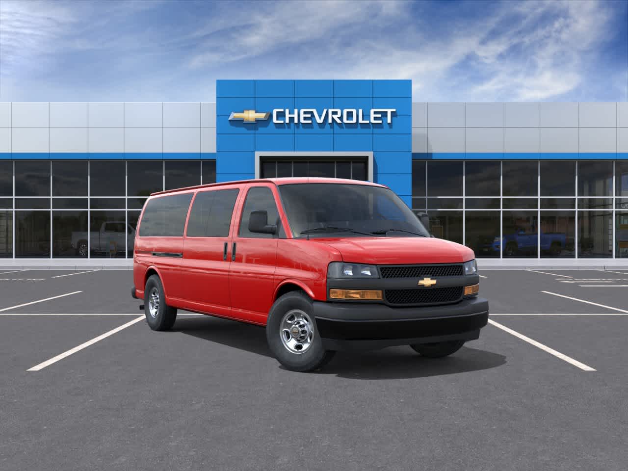 2026 Chevrolet Express Passenger 1LS in Red Hot — front three-quarter view