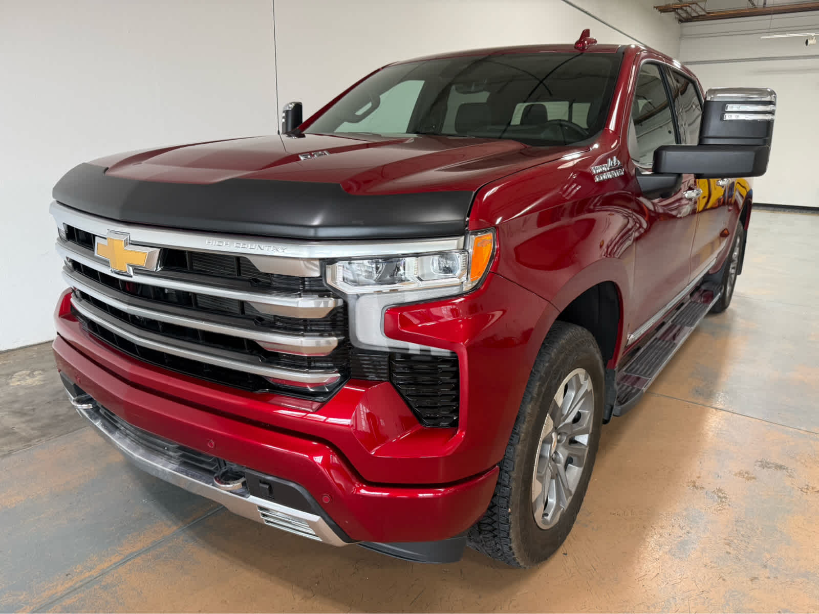 2024 Chevrolet Silverado 1500 High Country in Radiant Red Tintcoat — front three-quarter view