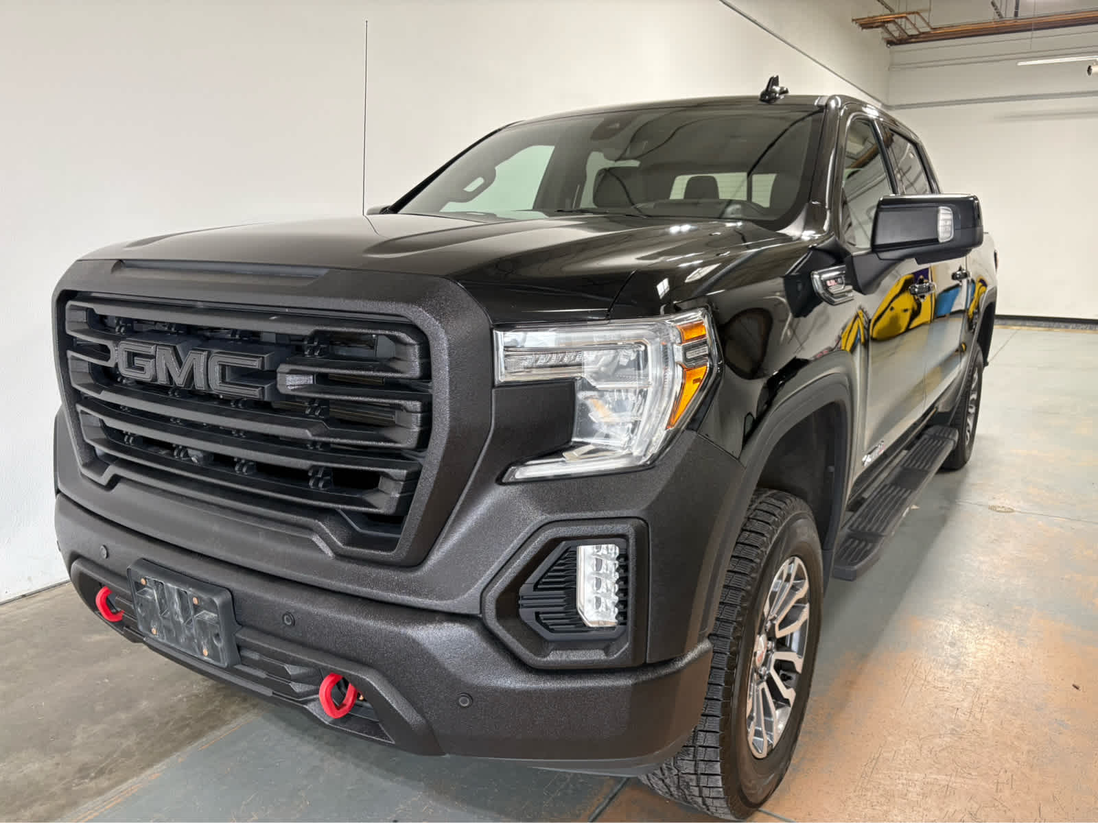 2020 GMC Sierra 1500 AT4 in Onyx Black — front three-quarter view